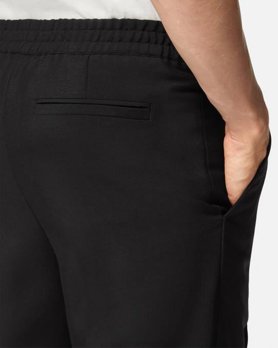 Versace ropa hombres pantalones jogger de mezcla de mohair 6BPV1450 negro
