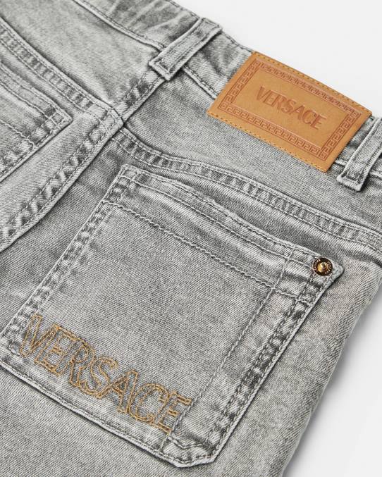 Versace ropa niños jeans desgastados con medusa 6BPV2135 gris